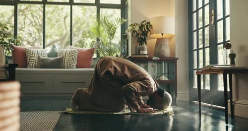 Muslim, faith and man with praying on mat for spiritual meditation, islamic worship or gratitude