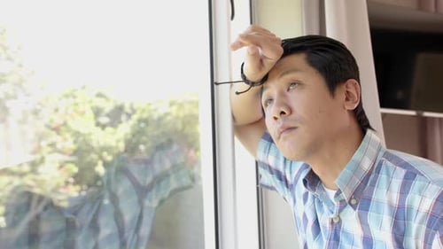 Man Looking Out Window, Thoughtful and Contemplative