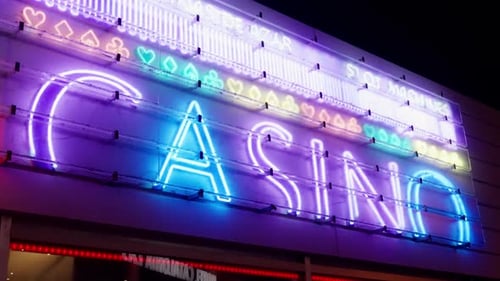 Bright Neon Casino Sign at Night
