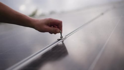 Closeup of Installing and Tightening a Solar Panel
