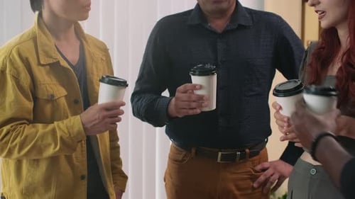 Colleagues Drinking Coffee in Office