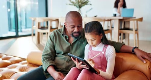 Adult and Child Enjoying Tablet Together at Home