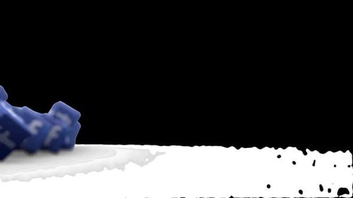 Verstreute Facebook-Logo-Blöcke auf einer weißen Oberfläche