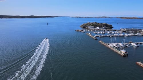 Boat Wake -Backwash From A Motorboat Cruising In The Ocean Near Marina In Lysekil, Sweden. - aerial