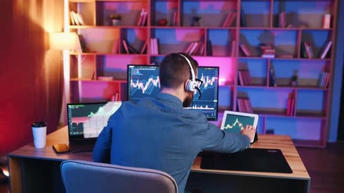 Focused Trader Analyzing Financial Data From Home Office