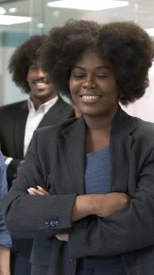 Contented Manager Posing with Team in Creative Office