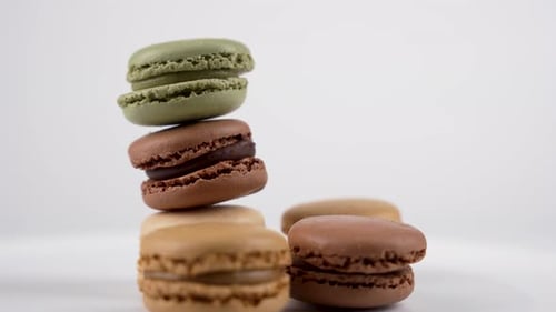 Colorful Macarons Stacked on White Background close-up shot