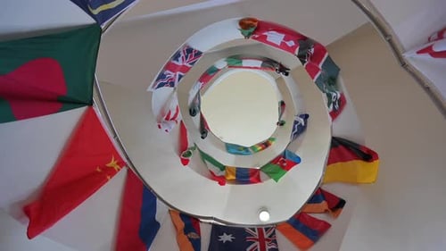 International Flags Decorate Spiral Staircase from Below
