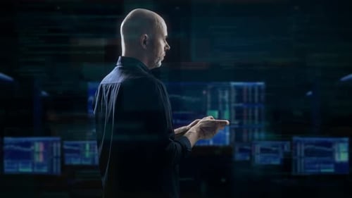 IT Auditor Scrutinizing Monitoring Dashboards And Threat Alerts With Focus And Determination