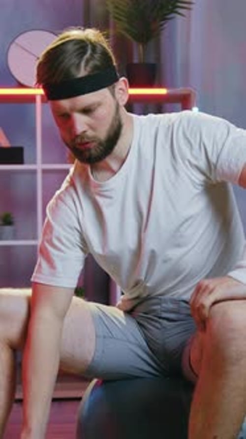Likable Sportive 30Aged Bearder in White Tshirtgrey Shorts and Black Headband Workouting at Home
