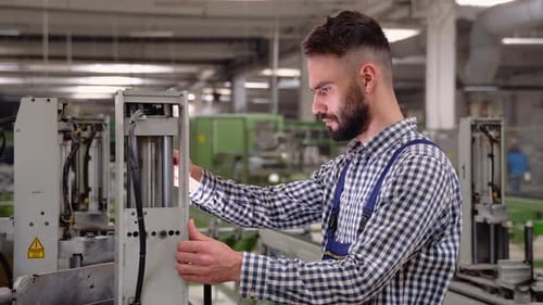 Smiling Industrial Specialist Standing in a Metal Construction Manufacture