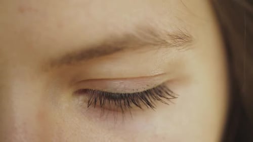 Girl's Left Eye Closes Tightly For Few Seconds And Open Again - close up