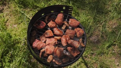 Juicy meat sizzles on the grill outdoors steaks cooking on barbecue concept of tasty leisure and coz