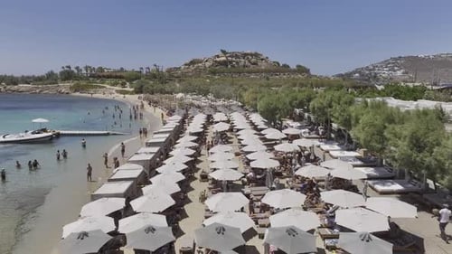 Aerial video of the beaches of Mykonos in the background, Santa Ana, Greece