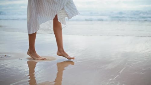 Woman Feet Stepping Sea Beach Closeup Slim Legs Walking Ocean Shore in Summer