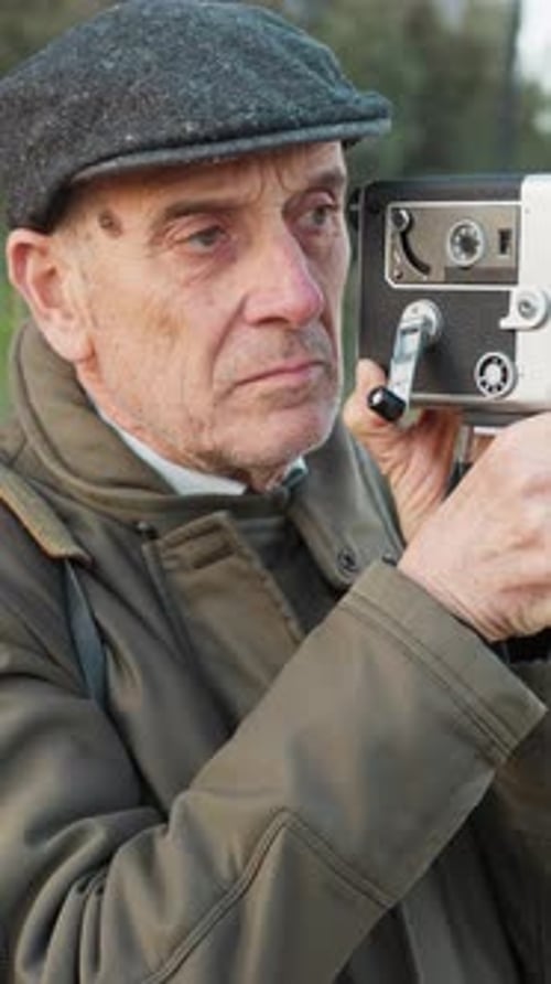 Elderly Man Notices Something Wrong While Filming with His Old Camera