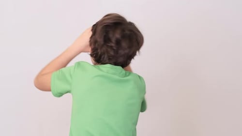 Smiling Boy Plays with Orange Halves