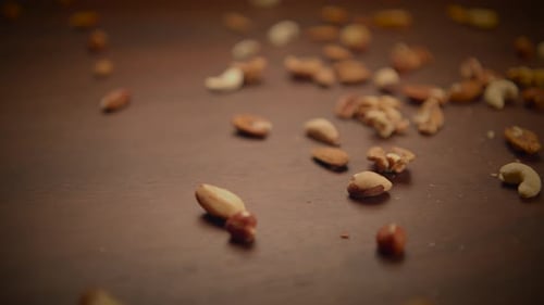 Variety of Mixed Nuts Spread on Wooden Surface