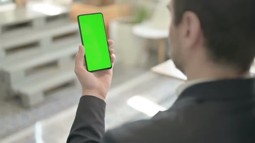 Businessman Using Phone with Green Chroma Screen