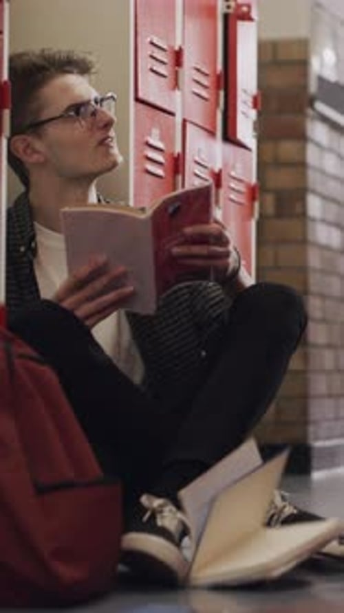 Education, bully and teen in high school with books, peer conflict and exclusion in hallway