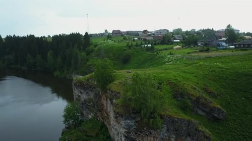 Breathtaking Scenic Cliffside View Overlooking a Serene Calm River and Lush Greenery Stock Clip