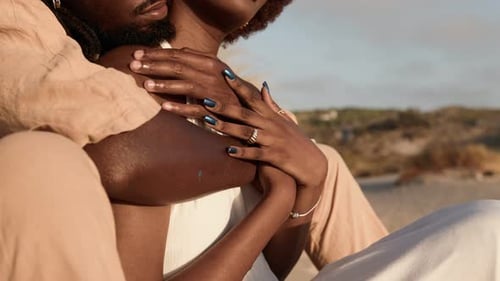Couple Embracing on Beach on Sunny Day