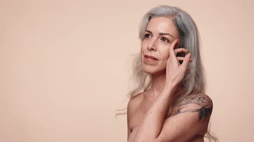 Senior Woman Showcasing Healthy Skin and Beauty in Studio