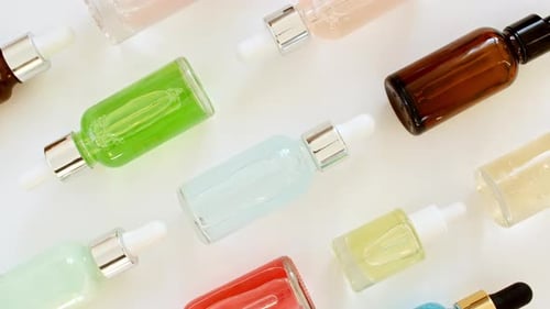 Colorful Bottles with Liquids For Fashion and Beauty