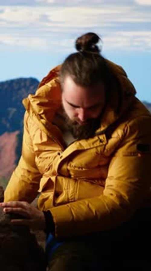 Vertical Video Determined Climber Standing at the Summit Enjoys Peaceful Moment