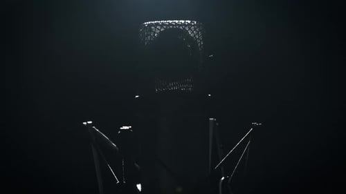 The Studio Condenser Microphone in Backlight Rotates on a Black Background