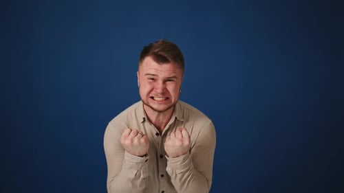 Man Expressing Anger and Frustration in Studio