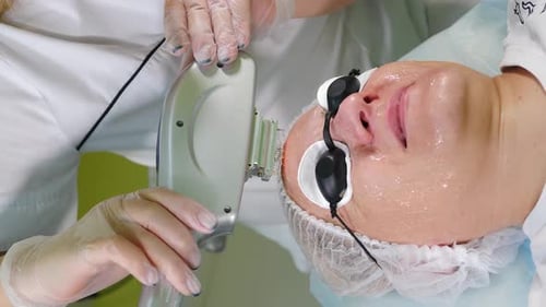 Skin Care Vertical Footage Aesthetic Procedure in Modern Cosmetology Clinic Expert Beautician Using