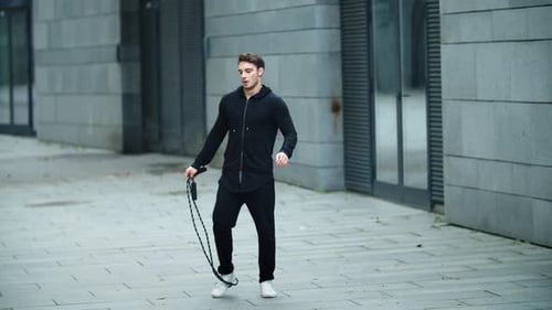 Athletic Man Skipping Rope in Urban Environment