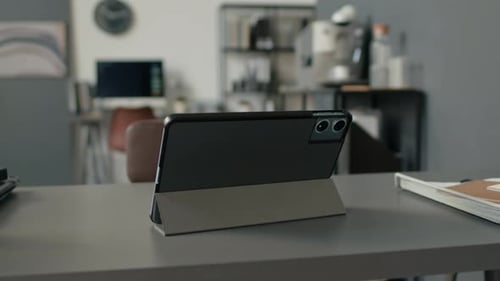 Digital Tablet on Stand on Table in Modern Minimalist Office