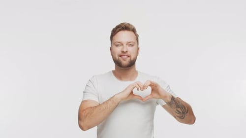 Expressive Young Man Over Vibrant Background Studio Portrait of Handsome Person