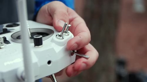 Close Up of a Hand Turning Drone Controller Switch