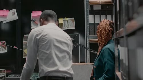 Colleagues Discuss Case in Police Office