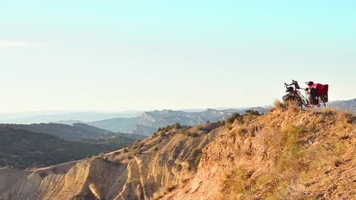 Bike Overlooking Arid Mountain Desert Landscape