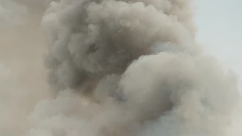 Billowing Plumes of Thick Gray and White Smoke