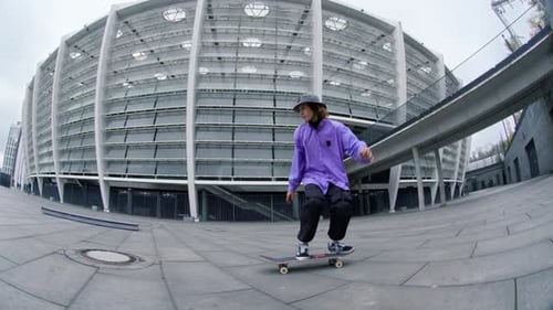 Skateboarder Doing Tricks in an Urban Environment