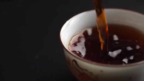 Close Up of Tea Pouring into Cup