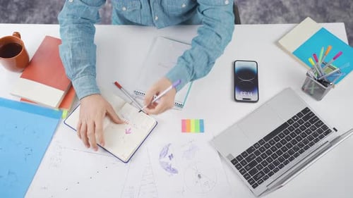 Overhead View of Man Working at Desk