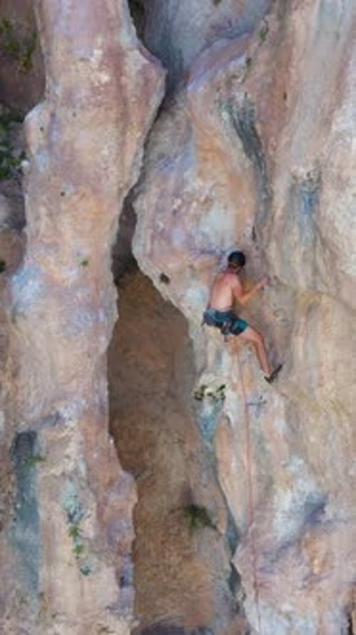 Man Climber Rock Climbing Antalya Turkey Aerial View Vertical Video