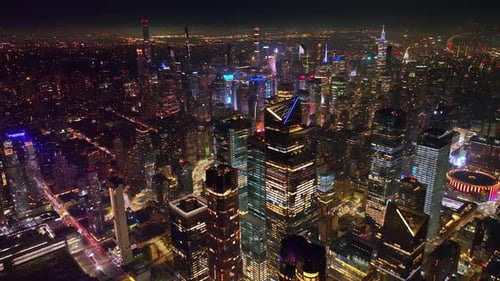 Stunning panorama of dazzling New York at night. Never sleeping metropolis drowning in the lights.