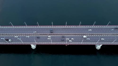 Aerial View of Cars Drive on Road Surrounded By Waters in Countryside Irrl