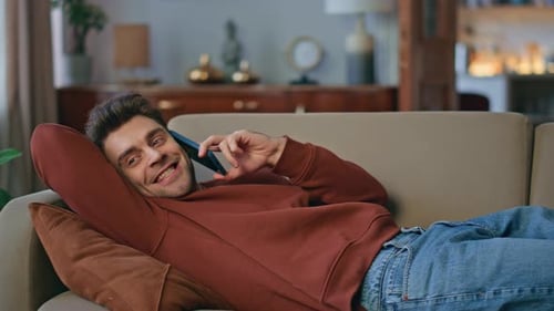 Happy Student Talking Cellphone Lying Couch Close Up Positive Man Enjoy Call