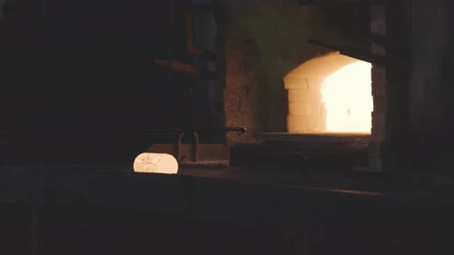 Glowing Object on Production Line with Bright Background