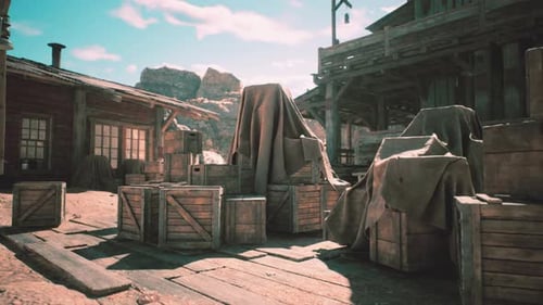 Abandoned Western Town with Wooden Crates Covered in Fabric in Daylight