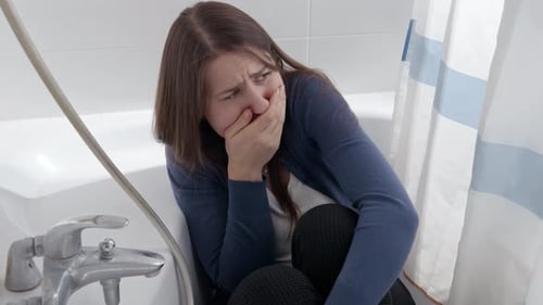 Woman Looking Upset in Bathtub Crying