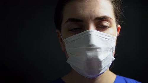 Health, Medicine and Pandemic Concept - Sad Young Female Doctor or Nurse